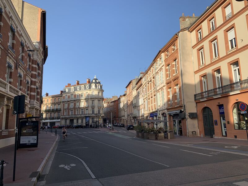 evening city scene of a wide avenue in Toulouse
